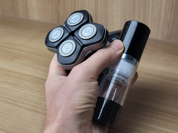 holding Domepeace Mattifying Moisturizer bottle with an electric head shaver