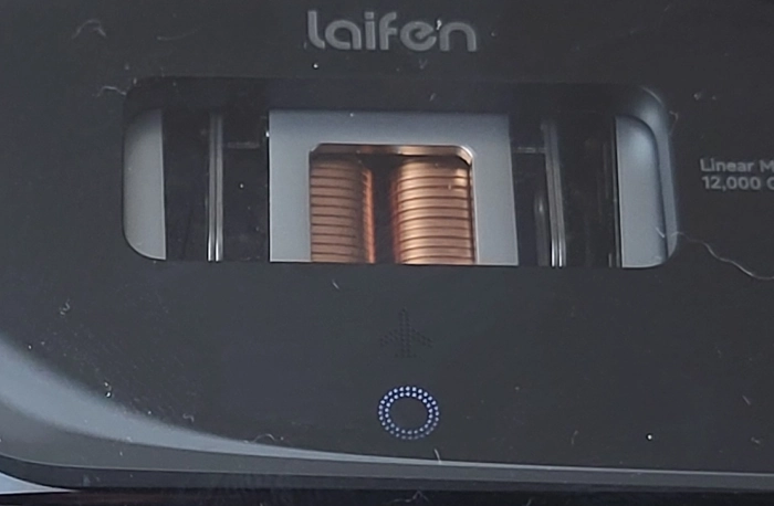 close up of Laifen P3 Pro on charge faint LED light