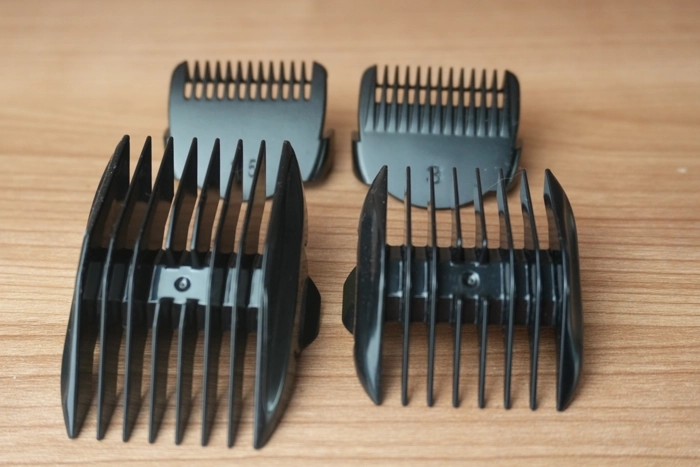 four Manspot groin and body trimmer combs laid out displayed