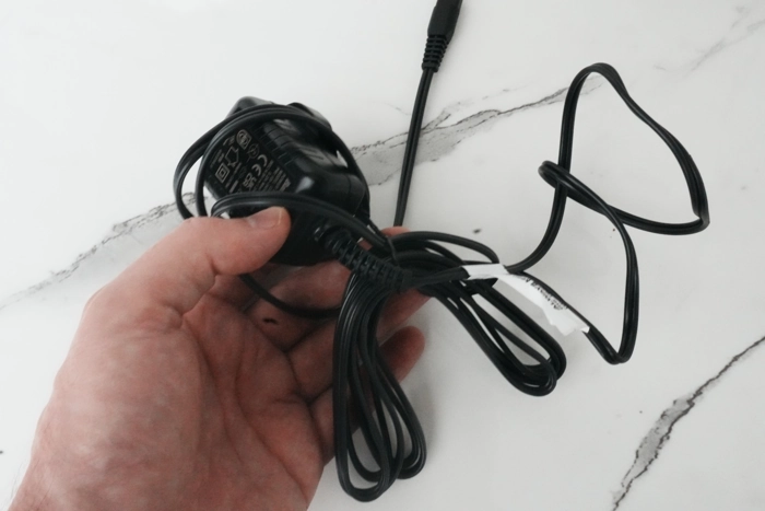 Babyliss Pro FOILFX02 charging cable and adapter displaying how long the cable is