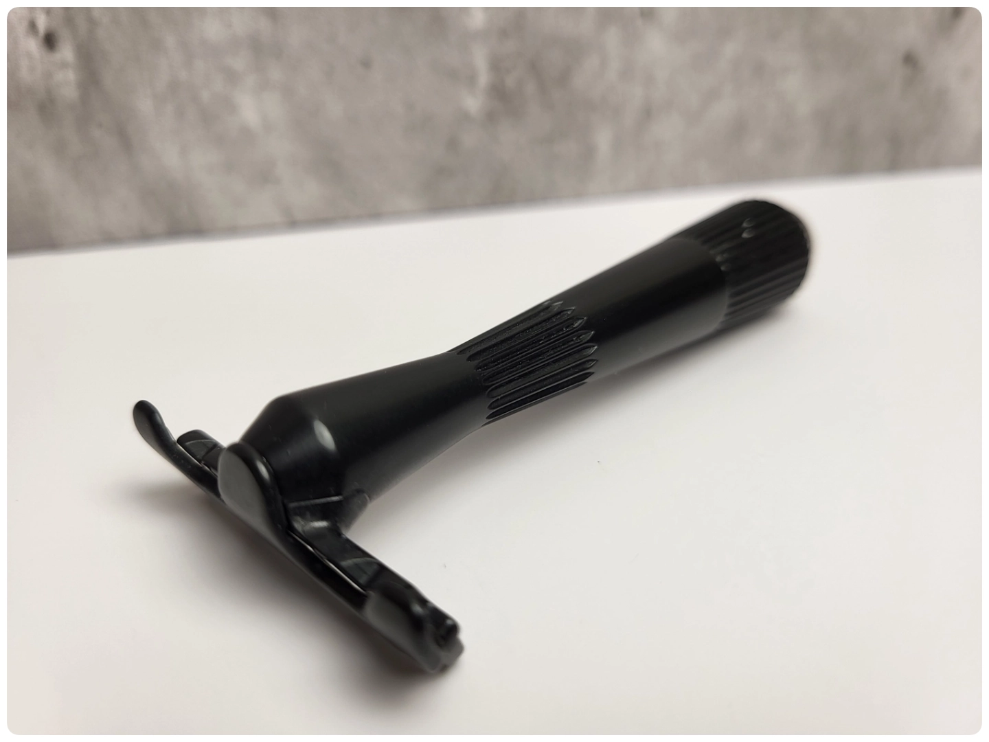 Leaf Twig Single Edge Razor laid on display with marble background